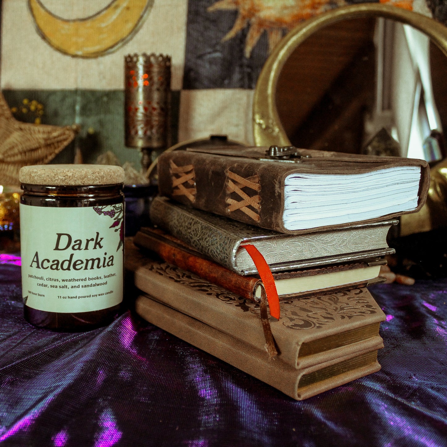 Jar labeled 'Dark Academia' on a table with books and decorative items.