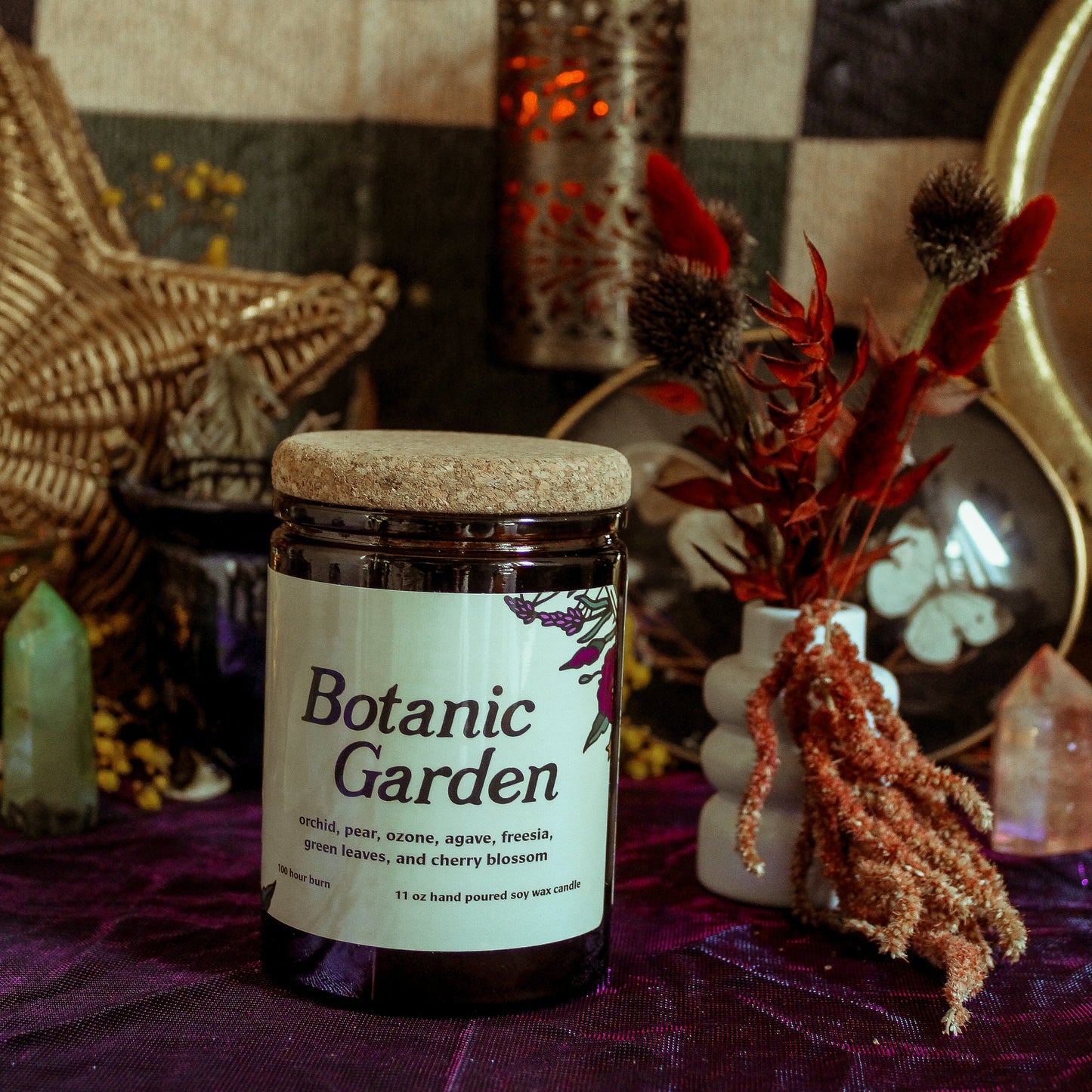 Jar labeled 'Botanic Garden' on a purple surface with decorative items in the background