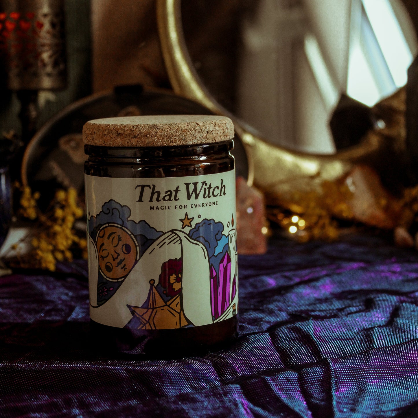 Jar labeled 'That Witch' on a mystical background with a mirror and candles.