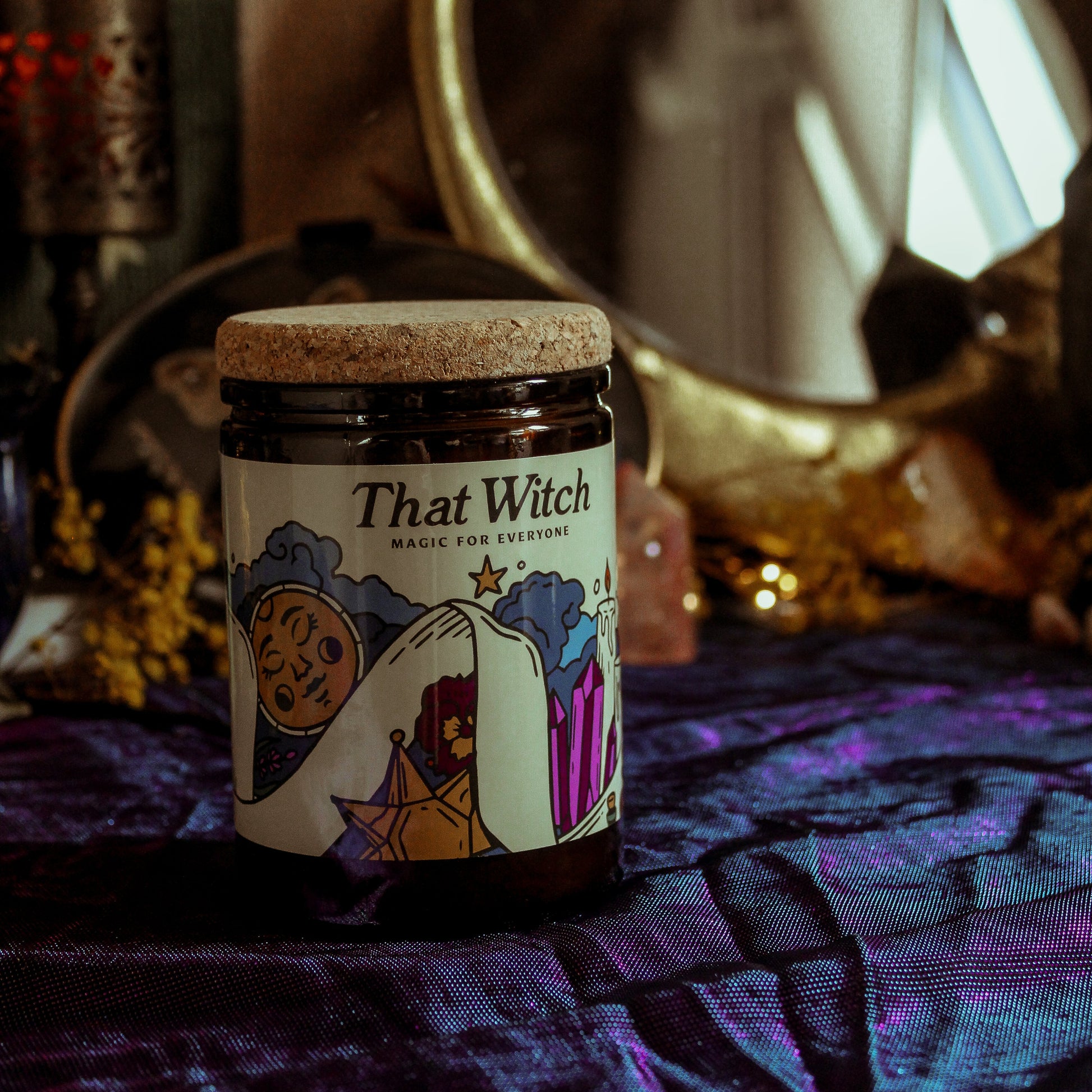 Jar labeled 'That Witch' on a mystical background with a mirror and candles.