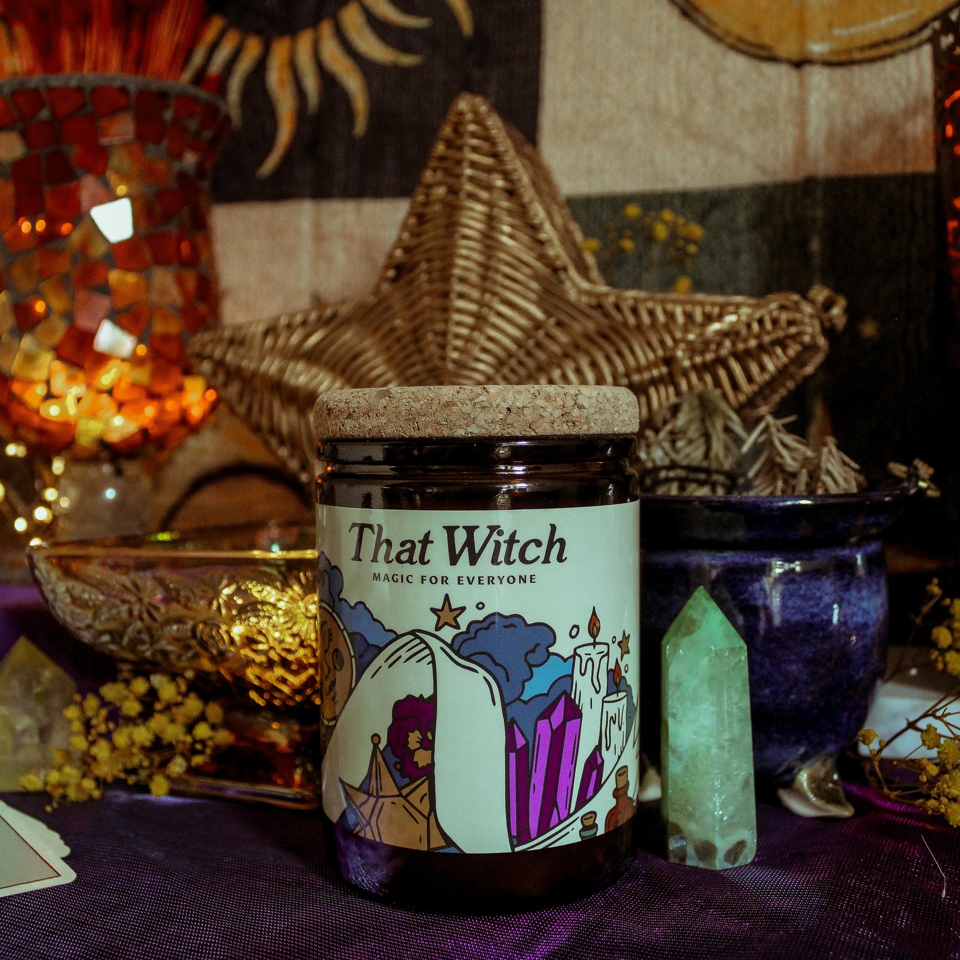 Jar labeled 'That Witch' on a mystical background with candles and star decorations.