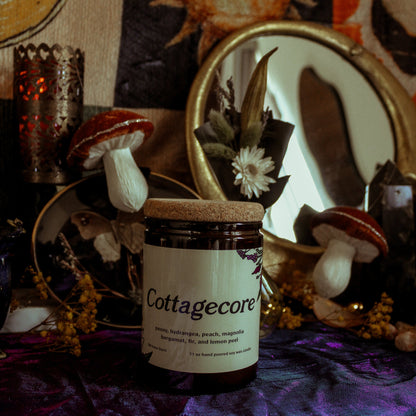 Cottagecore-themed product with mushrooms and decorative items on a textured surface